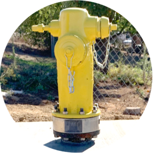 Water check valve on a yellow fire hydrant